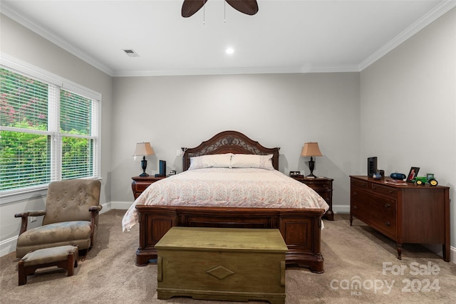 carpeted bedroom with ceiling fan and ornamental molding