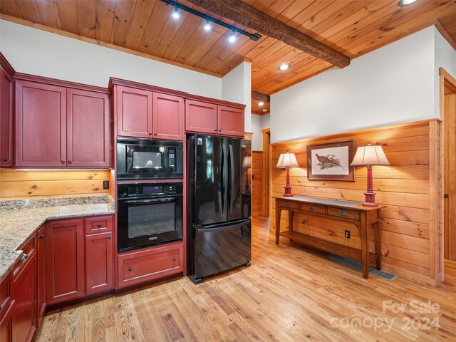 kitchen featuring light wood-type flooring, light stone countertops, wood ceiling, black appliances, and rail lighting