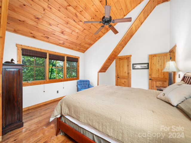 bedroom featuring wood ceiling, high vaulted ceiling, light hardwood / wood-style flooring, and ceiling fan