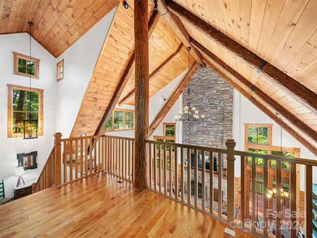 interior space featuring plenty of natural light, hardwood / wood-style floors, and wooden ceiling