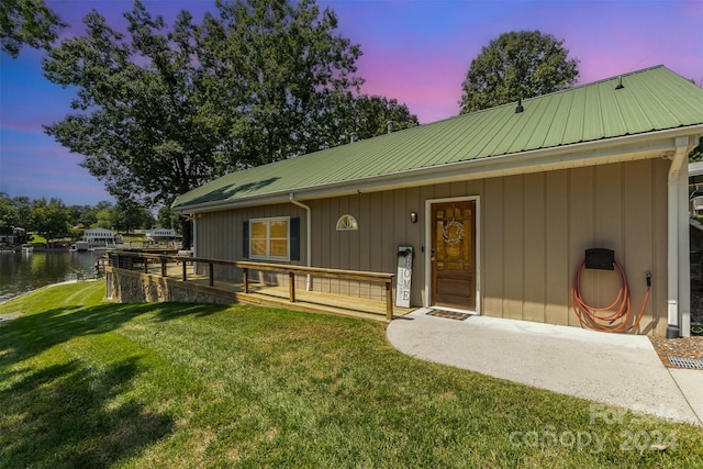 view of front of home with a yard