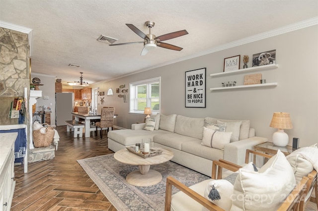 living room with a textured ceiling, crown molding, ceiling fan with notable chandelier, and dark parquet floors