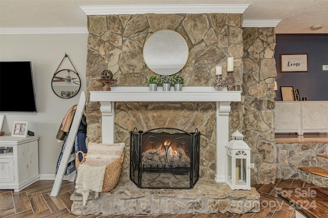 room details with parquet floors, crown molding, a textured ceiling, and a fireplace