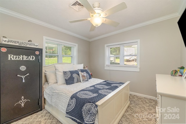 carpeted bedroom featuring multiple windows, ornamental molding, and ceiling fan