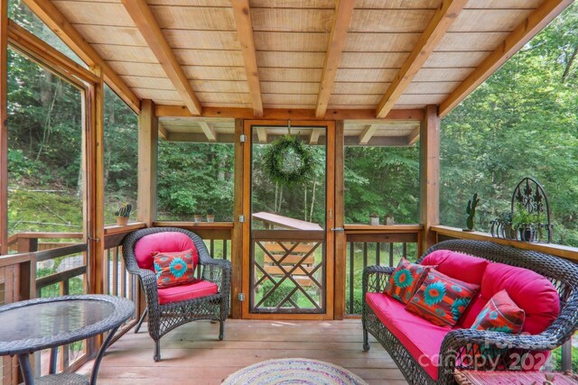 sunroom / solarium with wood ceiling and beamed ceiling