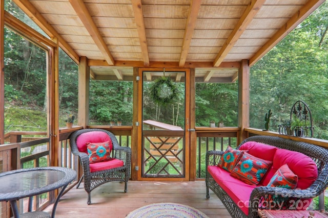 sunroom with beamed ceiling