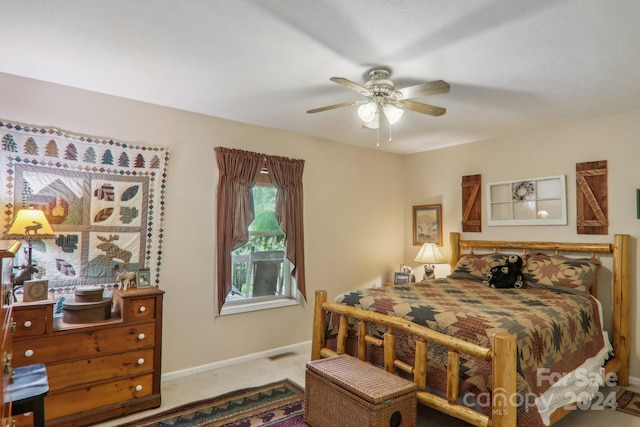 bedroom with ceiling fan, carpet, visible vents, and baseboards