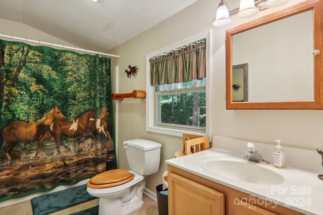 bathroom with tile patterned flooring, toilet, vanity, and lofted ceiling