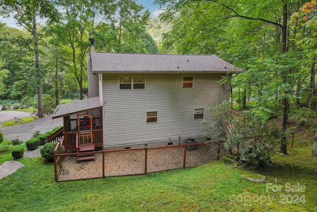 rear view of house with a lawn