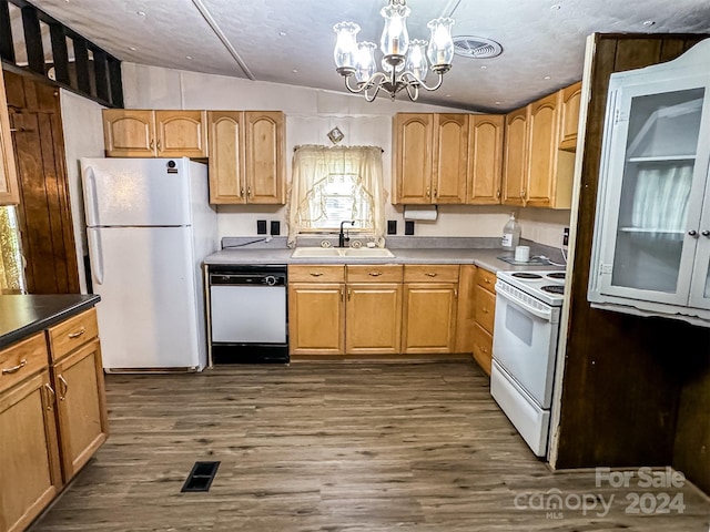 kitchen featuring a chandelier, vaulted ceiling, sink, white appliances, and dark wood-type flooring