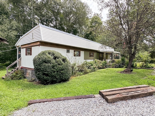 view of property exterior with a lawn