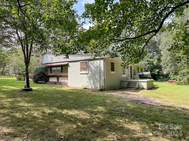 exterior space with a lawn