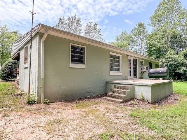 rear view of property with french doors