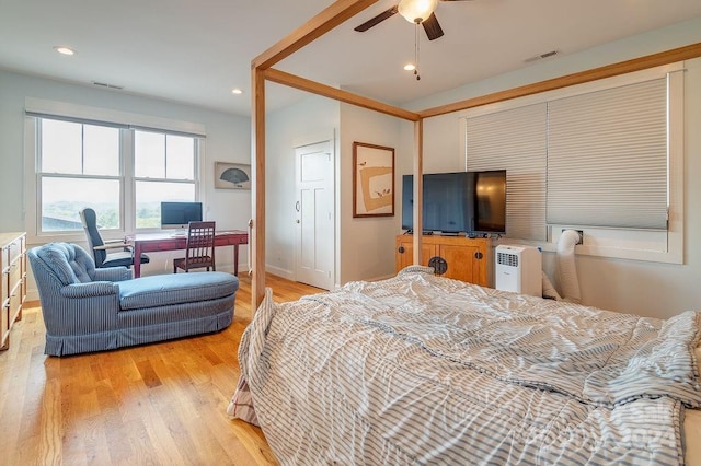 bedroom featuring light wood-type flooring and ceiling fan