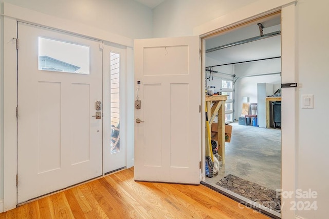 foyer entrance with light wood-type flooring