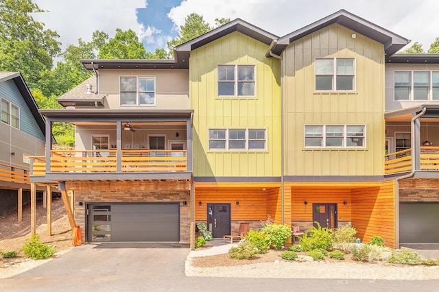 view of front of home with a balcony and a garage