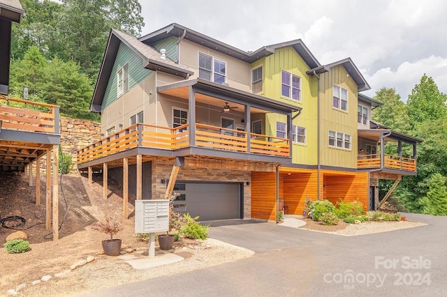 view of front of home with a balcony and a garage