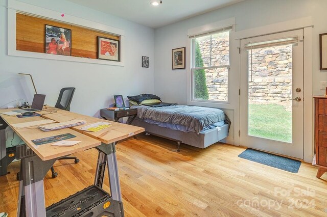 bedroom with light hardwood / wood-style flooring