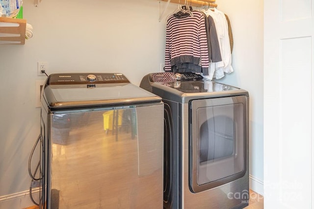 laundry area with washing machine and clothes dryer