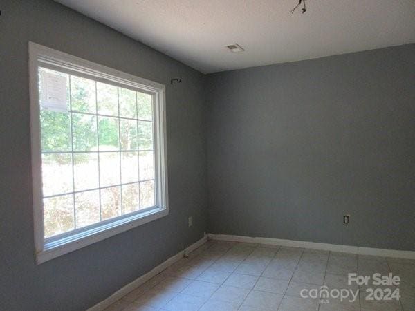 view of tiled spare room
