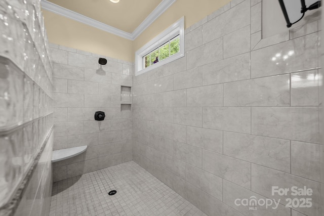 bathroom featuring tiled shower and crown molding