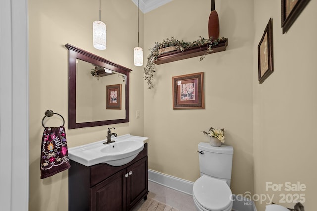 bathroom with crown molding, tile patterned flooring, vanity, and toilet