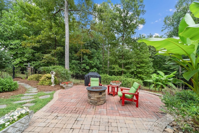 view of patio / terrace featuring an outdoor fire pit