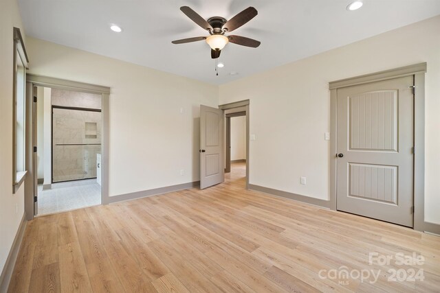 unfurnished bedroom with light wood-style floors, baseboards, and recessed lighting