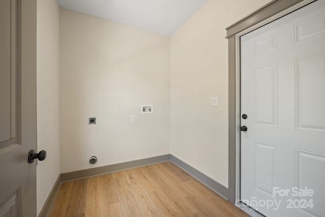 washroom with laundry area, baseboards, light wood-style floors, and electric dryer hookup