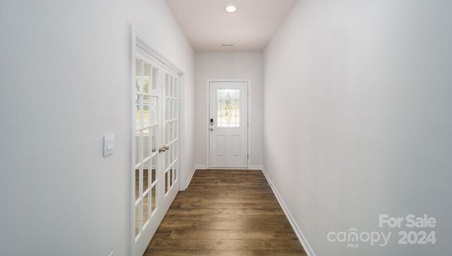 doorway to outside featuring dark hardwood / wood-style floors