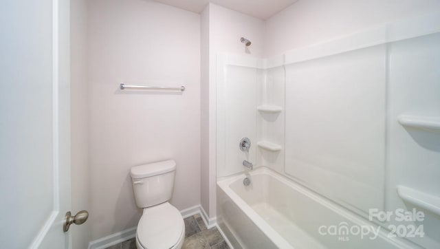 bathroom with shower / bathtub combination, toilet, and tile patterned floors