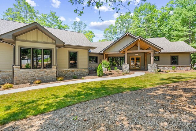 11 Nestlewood Dr Unit 310, Arden, NC 28704 - craftsman-style house with stone siding, french doors, a front lawn, and roof with shingles