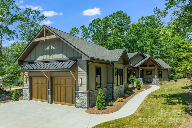 11 Nestlewood Dr Unit 310, Arden, NC 28704 - craftsman inspired home with stone siding, board and batten siding, a shingled roof, driveway, and a front yard