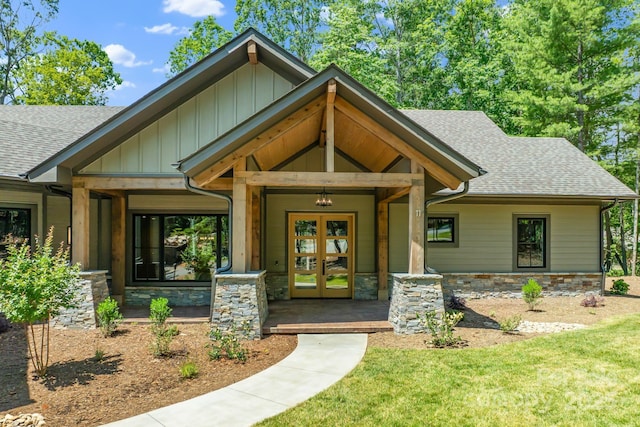 11 Nestlewood Dr Unit 310, Arden, NC 28704 - view of front facade featuring french doors, roof with shingles, stone siding, and a front yard