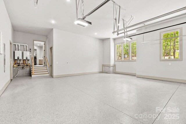 11 Nestlewood Dr Unit 310, Arden, NC 28704 - garage with a garage door opener, recessed lighting, and water heater