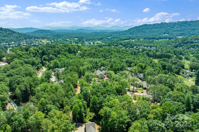11 Nestlewood Dr Unit 310, Arden, NC 28704 - drone / aerial view of a heavily wooded area and a mountain backdrop
