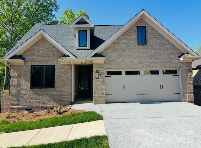 5106 Silver Trace Ln Unit 90, Denver, NC 28037 - view of front of home featuring concrete driveway, roof with shingles, an attached garage, crawl space, and brick siding