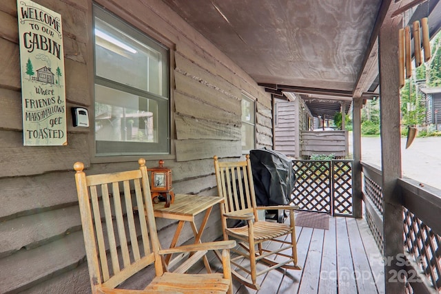 wooden terrace with grilling area