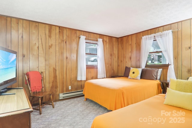 bedroom featuring baseboard heating, light carpet, multiple windows, and wood walls