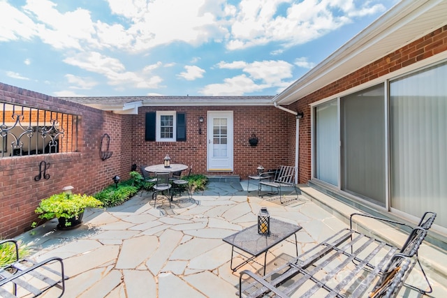 view of patio / terrace with outdoor dining space and fence