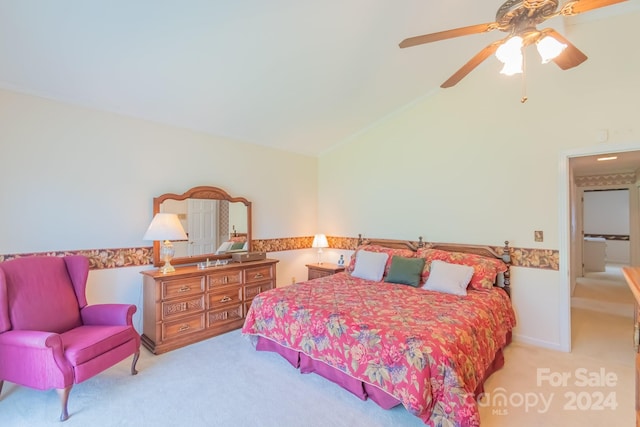 bedroom with ceiling fan, light carpet, and lofted ceiling