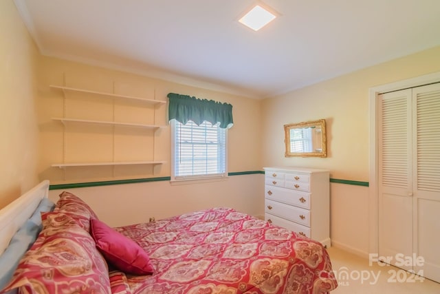 carpeted bedroom featuring a closet