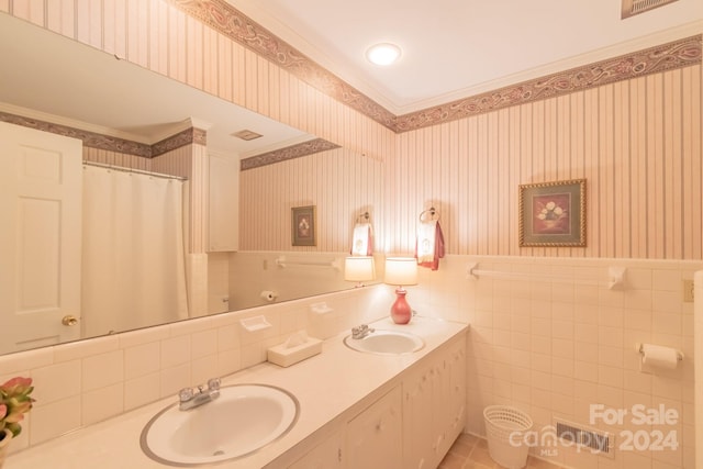 bathroom with ornamental molding, vanity, tasteful backsplash, tile patterned floors, and tile walls