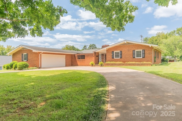 1405 Northcrest Dr, Albemarle, NC 28001 - ranch-style house with brick siding, a front yard, driveway, and an attached garage