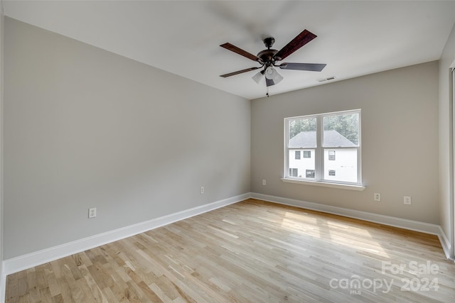 unfurnished room featuring ceiling fan and light hardwood / wood-style flooring