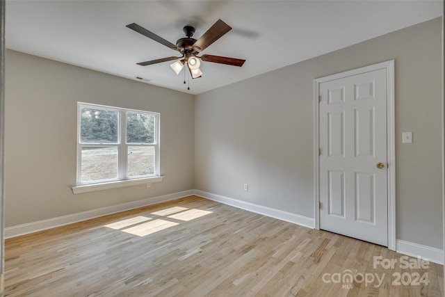 unfurnished room with ceiling fan and light hardwood / wood-style flooring