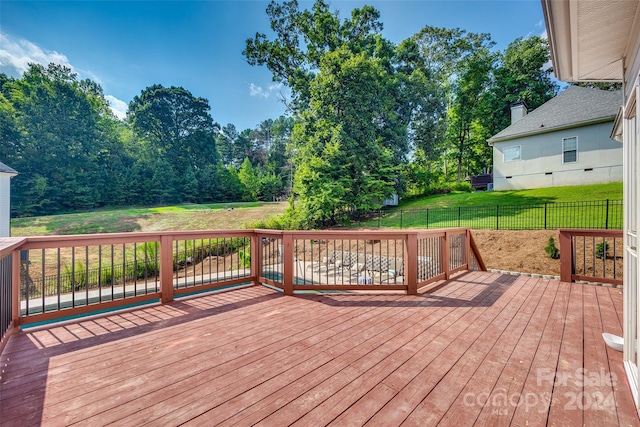 wooden terrace with a yard