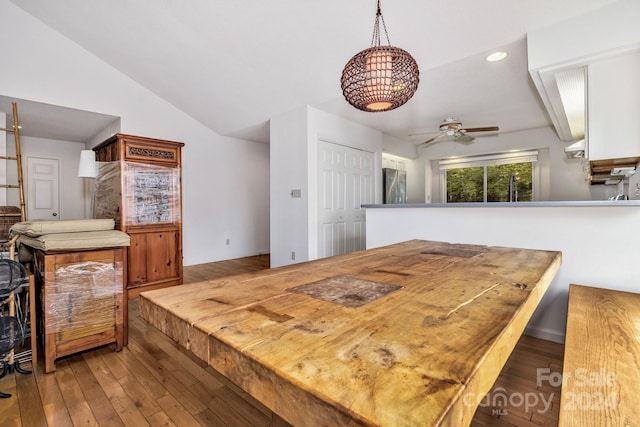 dining space featuring lofted ceiling, ceiling fan, recessed lighting, and wood finished floors