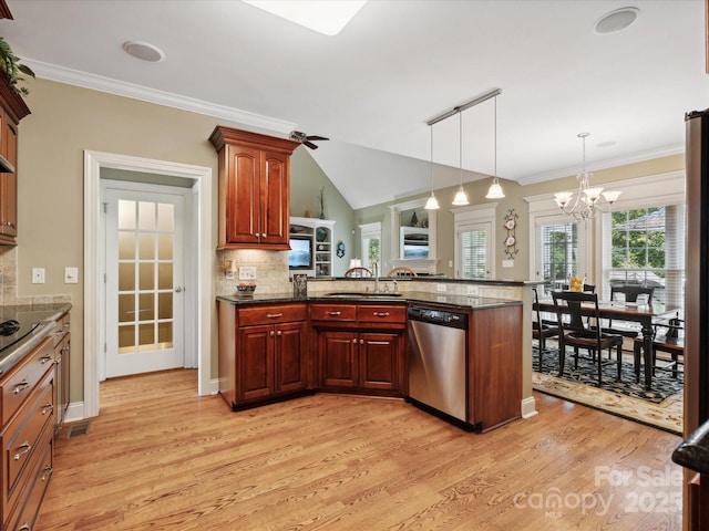 kitchen featuring tasteful backsplash, stainless steel dishwasher, a notable chandelier, kitchen peninsula, and pendant lighting