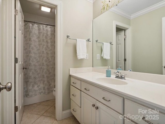 bathroom with tile patterned floors, vanity, toilet, and crown molding